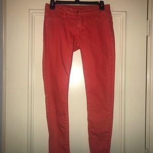 orange designer skinny jeans